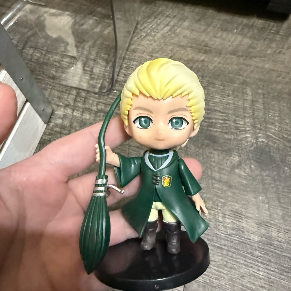 Green Cloaked Figurine with Broom